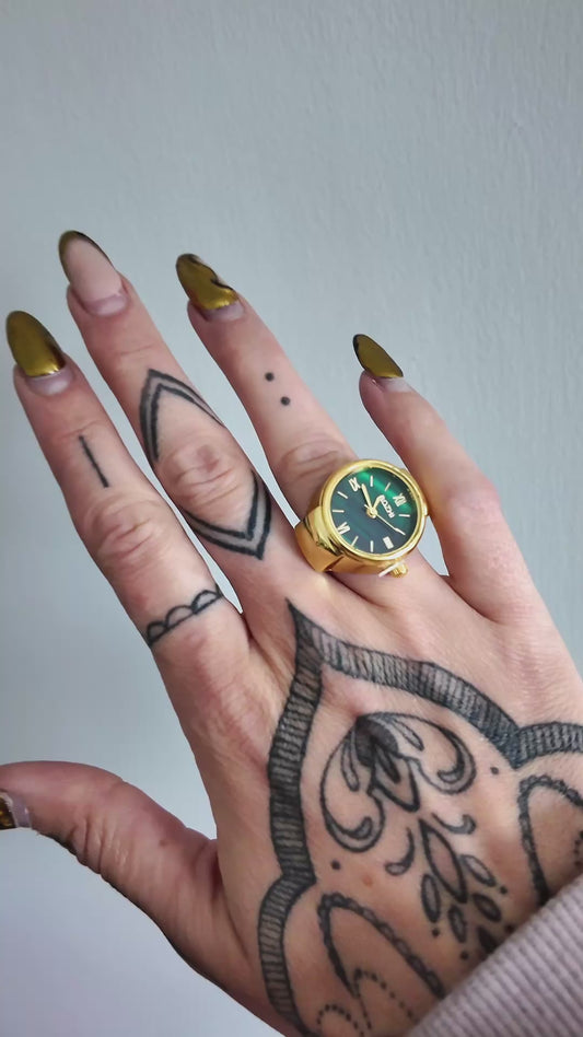 Green and gold watch ring